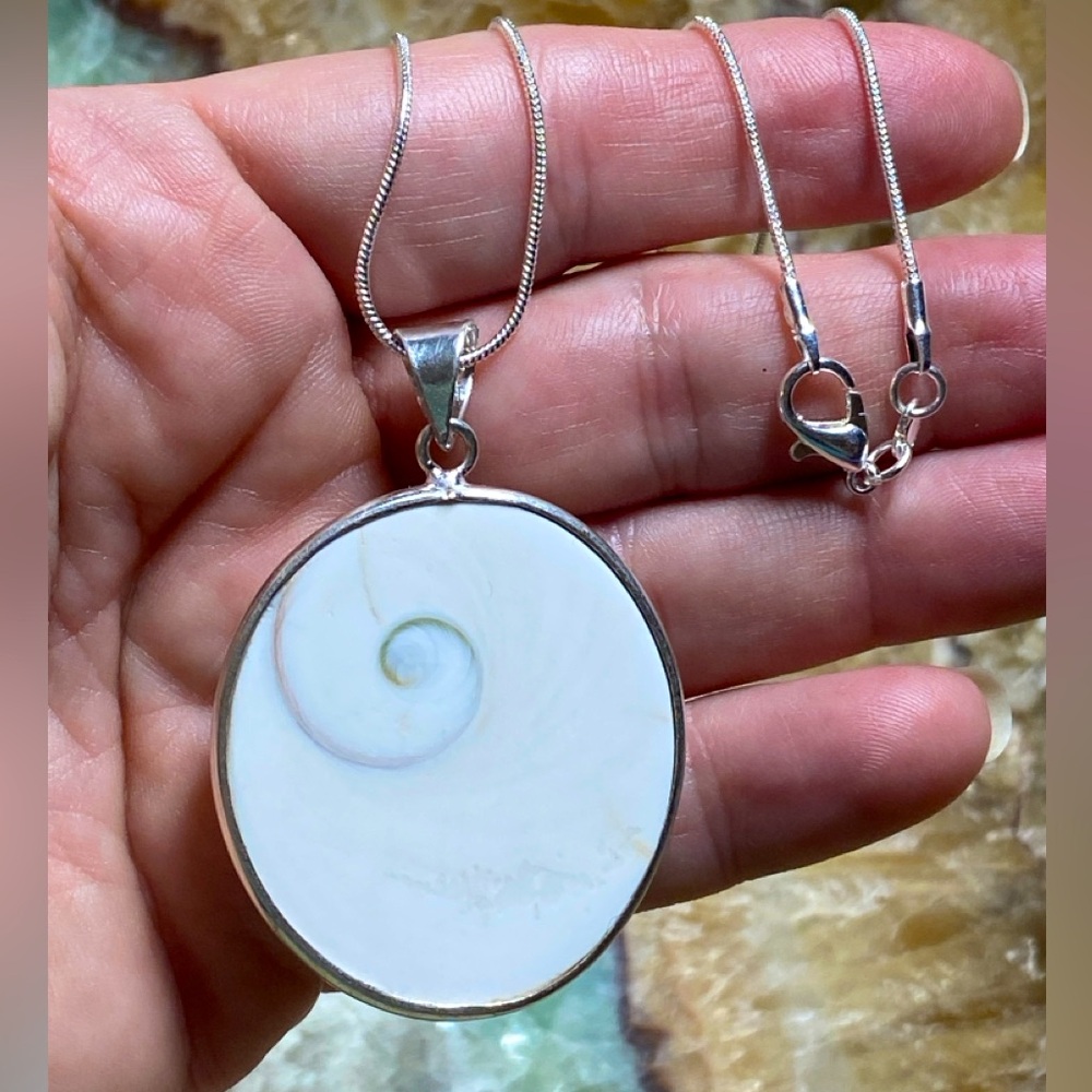 SHIVA SHELL Pendant .925 sterling silver overlay bezel and bail. Mermaid core.